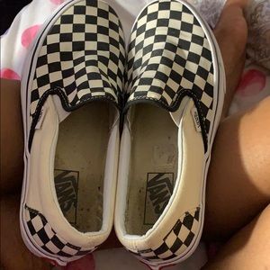 black checkerboard slip on vans